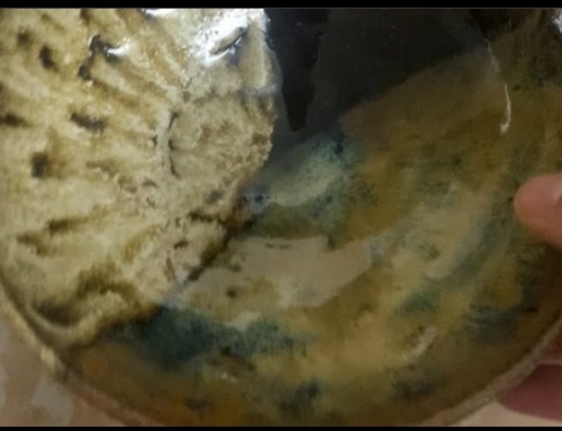starry night with aqua and coastal, one — inside a muddy green-brown bowl, close up