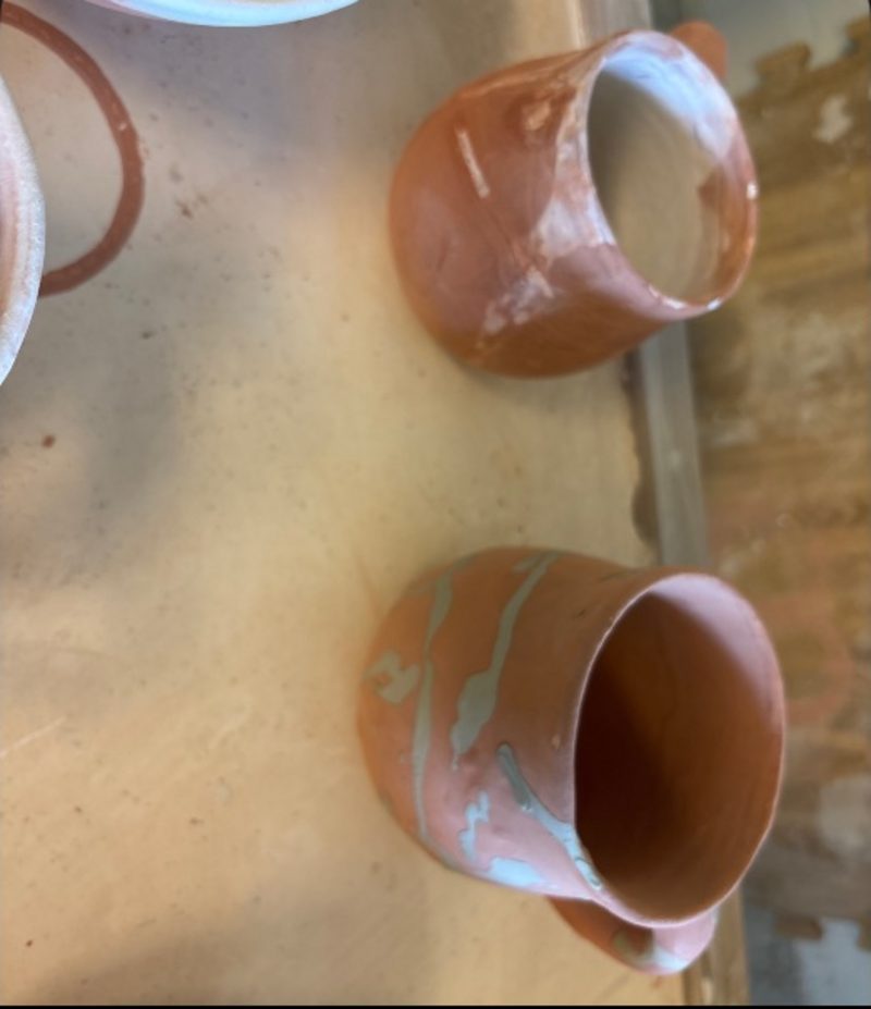 Seafoam 2 on Dragon… — bisqued mugs lying on their sides, waiting